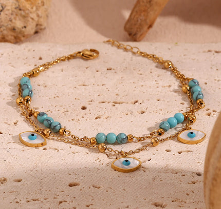 E.B.belle Tres ojos de concha blanca Piedra turquesa azul Cadenas de pies de doble capa Tobillera de acero inoxidable 316L chapada en oro de 18 quilates