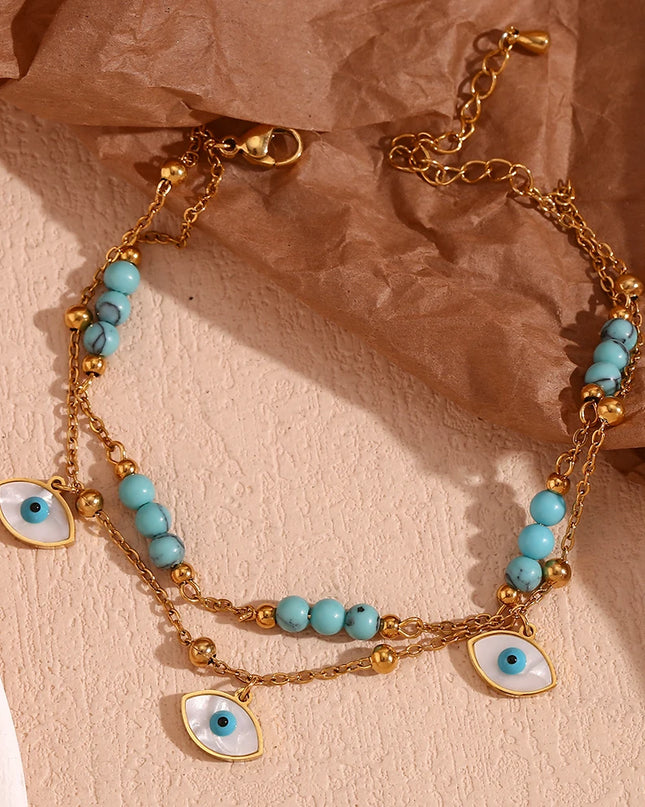 E.B.belle Tres ojos de concha blanca Piedra turquesa azul Cadenas de pies de doble capa Tobillera de acero inoxidable 316L chapada en oro de 18 quilates