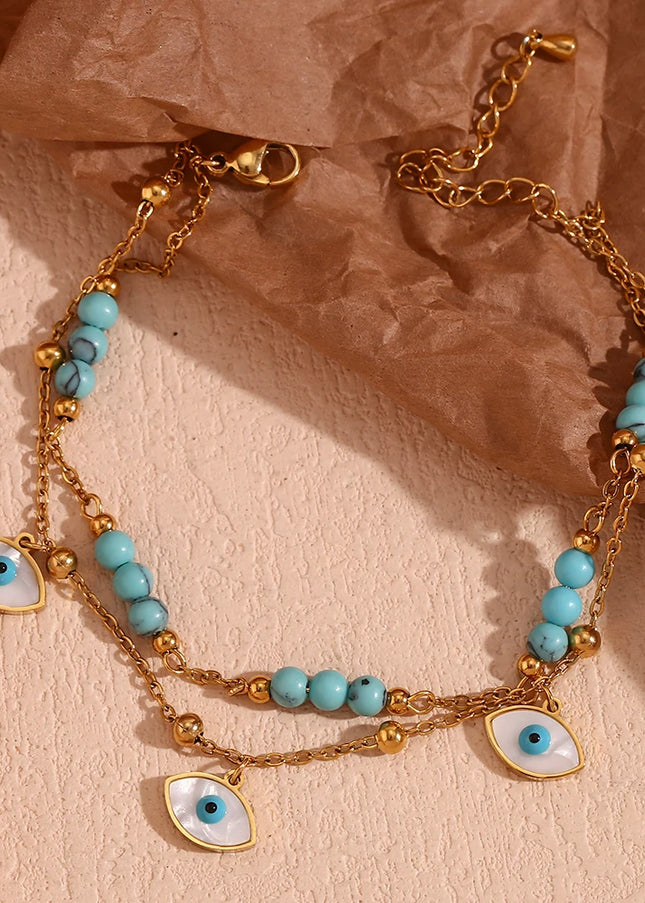E.B.belle Tres ojos de concha blanca Piedra turquesa azul Cadenas de pies de doble capa Tobillera de acero inoxidable 316L chapada en oro de 18 quilates