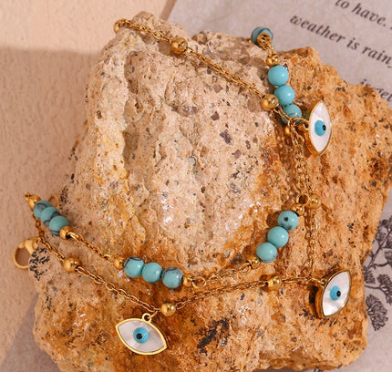 E.B.belle Tres ojos de concha blanca Piedra turquesa azul Cadenas de pies de doble capa Tobillera de acero inoxidable 316L chapada en oro de 18 quilates